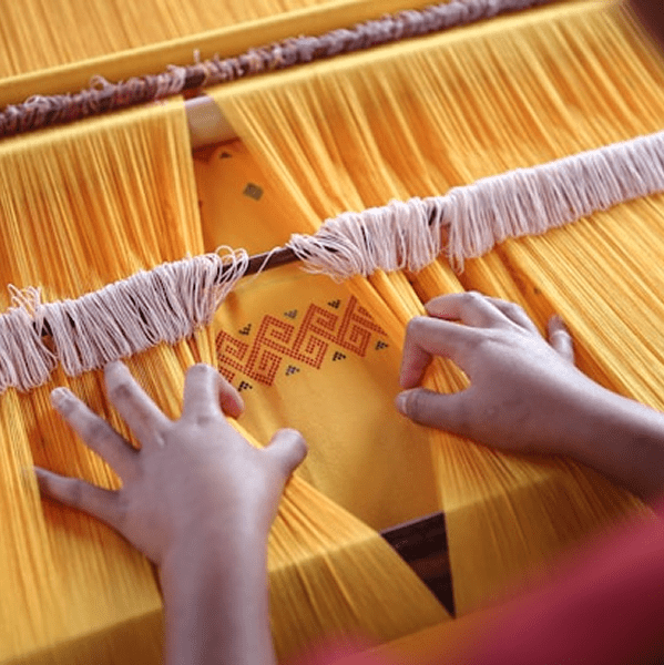 Yellow fabric on sewing machine